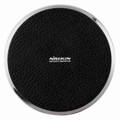 A top-down view of a round wireless charger.