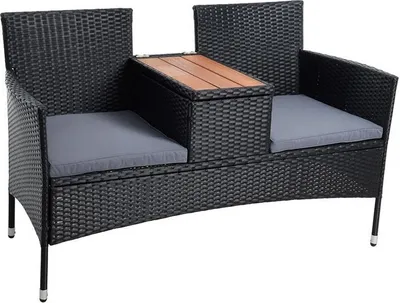 A black polyrattan garden bench with gray cushions and a wooden tabletop.