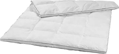 A white down comforter is shown laid out on a white background.