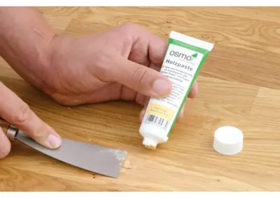 Produktbild von OSMO | 0,10 Kilogramm | Holzpaste 7300 Weiß 500 ml, Holzkitt für Risse, schnelle Anwendung, guter Halt, wasserfrei, hochwertige Versiegelung, Bodenpflegemittel