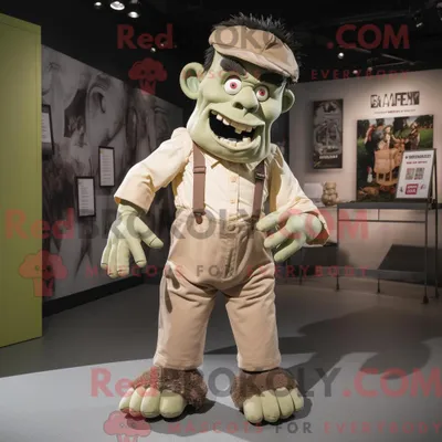 Obrázok produktu pre Maskot spoločnosti REDBROKOLY, béžové monštrum pripomínajúce Frankenšteina, oblečené v pracovných nohaviciach (džínsach) s náprsníkovými vreckami