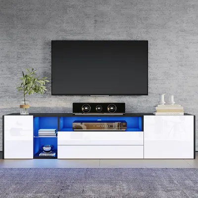 Produktbild von TV-Lowboard 180 cm für 75-Zoll-Fernseher, schwarz-weißes TV-Board mit Hochglanzfront, zwei Schubladen, zwei Schrankfächern und LED-Beleuchtung