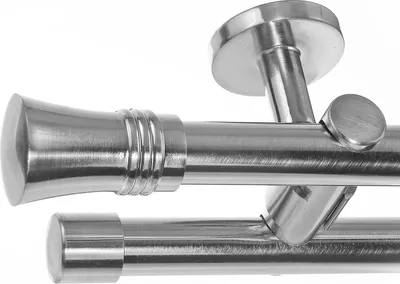 Close-up view of two brushed metal curtain rods with ceiling mounts.