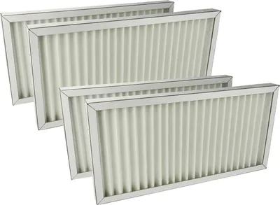 A group of four pleated air filters are arranged in a staggered diagonal line against a white background.