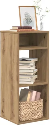A wooden bookshelf with three shelves, decorated with books and a framed picture.