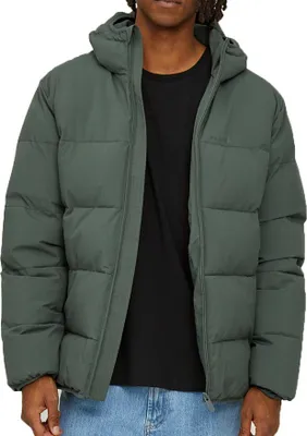 A person wearing a green puffer jacket.