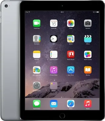 A silver iPad Air 2 with a black screen displaying various app icons is shown from a slightly angled front view. The background is a dark, starry sky with a mountain landscape.