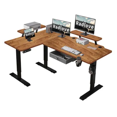 An L-shaped standing desk with two monitors, a printer, a tablet, a keyboard, a mouse, a drawer, and a headphone holder.