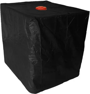 A black tarp covering a large cube-shaped object with an orange cap on top.