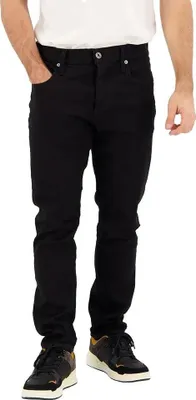 A person wearing black jeans and sneakers, standing against a white background.