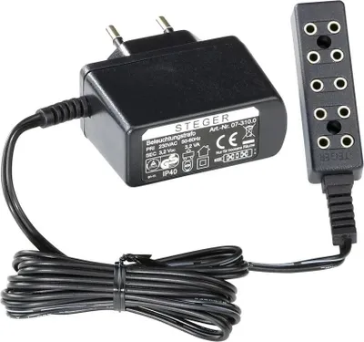 A black electrical adapter and a black multi-port connector are shown on a white background.