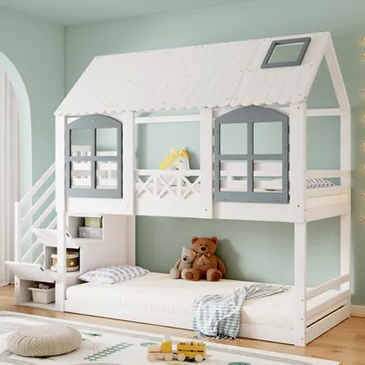 A children's bunk bed designed like a house, with storage stairs and a mattress on the bottom bunk.