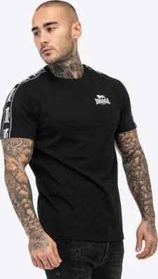A man wearing a black Lonsdale t-shirt.