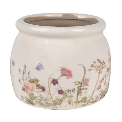 A ceramic pot with a floral design.