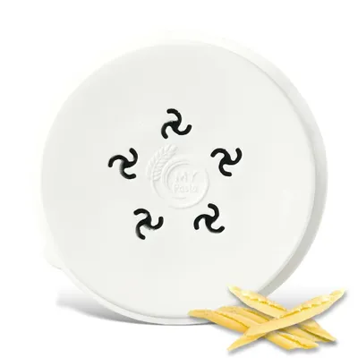 A white lid with a pasta maker attachment and some dried pasta pieces.