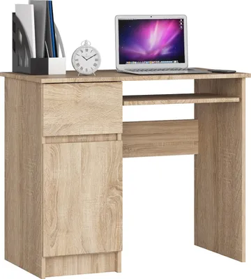 A light brown wooden computer desk with a laptop, a clock, and a file holder on top.