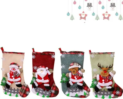 Four Christmas stockings are displayed side-by-side against a white background. The stockings are decorated with various Christmas characters and patterns.