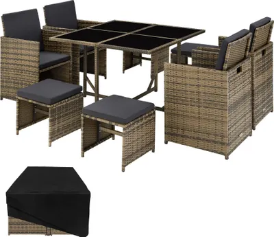 A rattan dining set with chairs, stools, and a table, along with a protective cover.