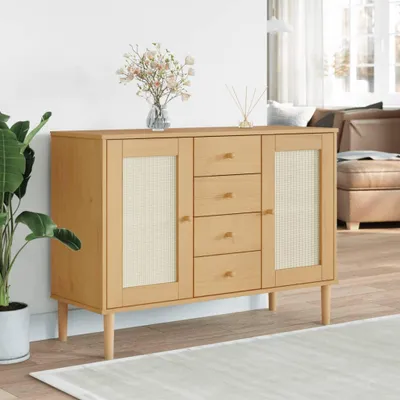 A wooden sideboard with rattan-look doors and drawers, decorated with a vase of flowers and a diffuser, placed in a living room setting.