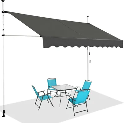 An outdoor patio scene with a gray awning extended over a glass-topped table and four blue chairs.