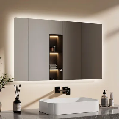 A modern bathroom vanity with a large LED mirror above a rectangular sink.