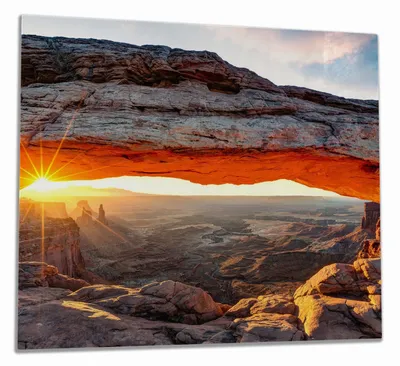 Produktbild von Wallario Herdabdeckplatte aus Glas, Größe 60 x 52 cm 1-teilig, Motiv Sonnenstrahl am Horizont  Leuchtende Felsspalte