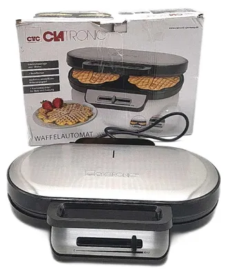 A Clatronic waffle maker is shown in its original packaging, with the product itself also visible.