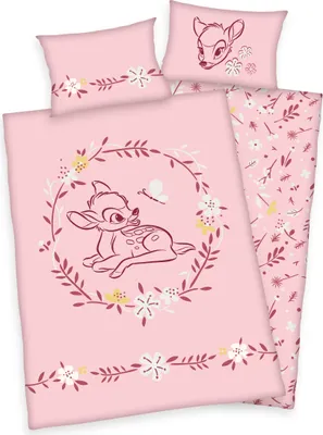 A pink bedding set with a Bambi theme, featuring a fawn and floral designs.
