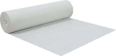A roll of white non-woven fabric is unrolled on a white surface.