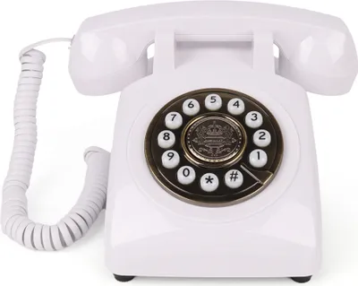 A white rotary dial telephone on a white background.