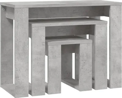 A set of three nesting tables with a concrete-like finish.