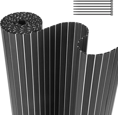A rolled-up privacy screen made of vertical slats, with a few zip ties shown in the upper right corner.