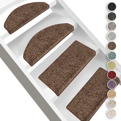 Several brown stair mats are placed on white stairs.