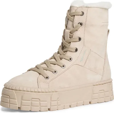 A single beige boot is shown against a white background.
