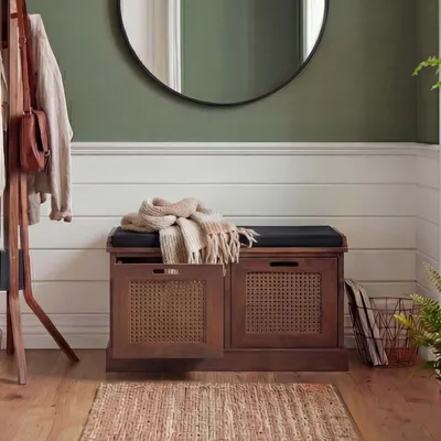 A hallway or entryway with a bench, coat rack, and mirror.