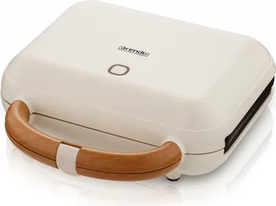 A studio shot of a sandwich maker on a white background.