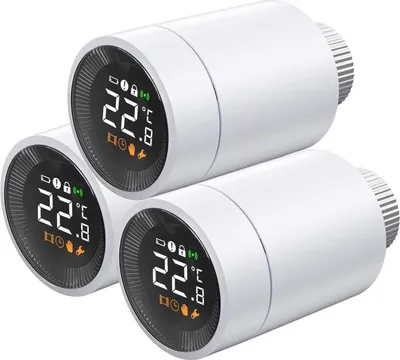 Three white smart radiator thermostats are stacked on a white background.