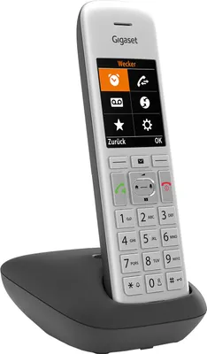 A white and gray Gigaset cordless phone is shown in its charging base against a white background.
