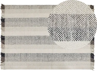 Produktbild von BELIANI Teppich Cremeweiß Wolle 140 x 200 cm Rechteckig Handgewebt Streifenmuster Schwarz / Braun Kurzflor mit Fransen Boho Wohnzimmer Schlafzimmer