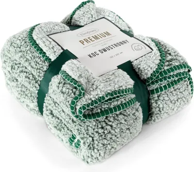 A folded blanket with a label.