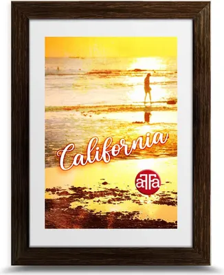 A framed poster of a California beach sunset with a person walking on the shore.