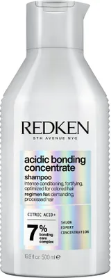A white bottle of Redken Acidic Bonding Concentrate Shampoo.