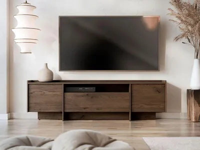 A modern living room with a TV stand and television.