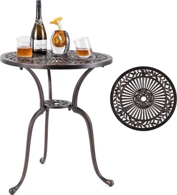 A round bistro table with a decorative top and three curved legs, set on a white background. A bottle of champagne, a vase with a yellow flower, and two glasses of amber liquid are placed on the table. A separate decorative table top is shown to the right.