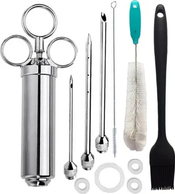 A collection of stainless steel meat injectors and cleaning tools, including a brush and a basting brush, arranged on a white background.