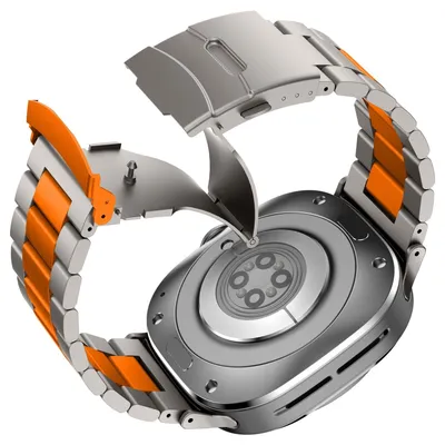 The back of a smartwatch with a metal and orange watchband is shown.