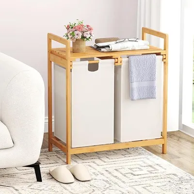 Zdjęcie produktu dla Kosz na pranie z 2 przegrodami, pojemnik na pranie z półką, wolnostojąca półka łazienkowa z bambusa, sortownik na pranie do łazienki 64 x 33 x 73 cm (biały)
