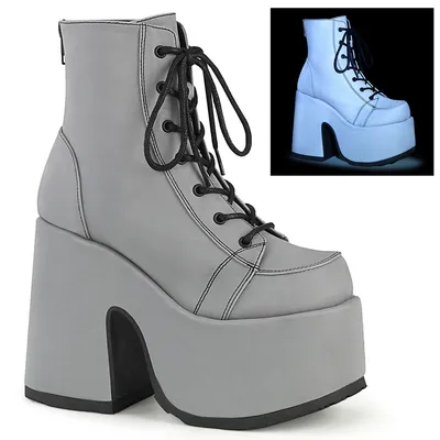 A single gray platform boot with black laces is shown against a white background. A smaller inset image shows the same boot with a blueish glow.