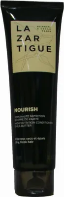 A product shot of a black tube of hair conditioner.