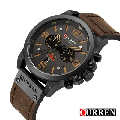 A close-up, angled shot of a men's wristwatch with a leather strap.